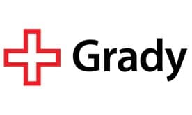Logo with a red cross and text reading Grady
