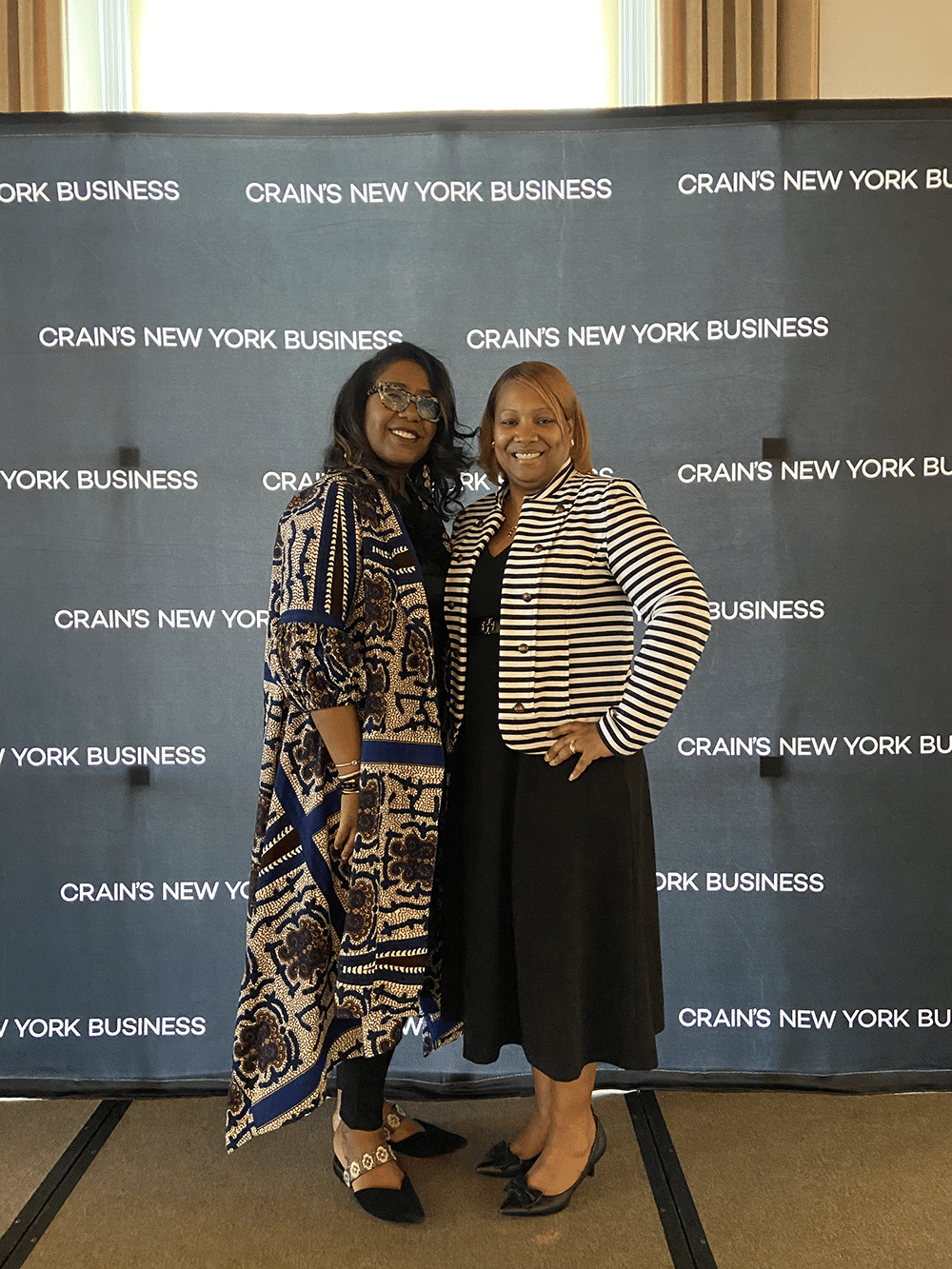 Photo of Michellene Davis and Cassundra Howell before the Crains New York Business Backdrop