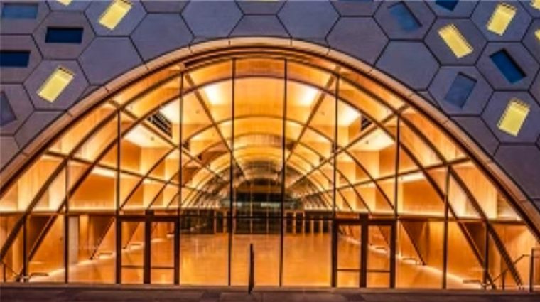 Photo of the Audrey Irmas Pavillion, which has arched glass windows and a doorway.