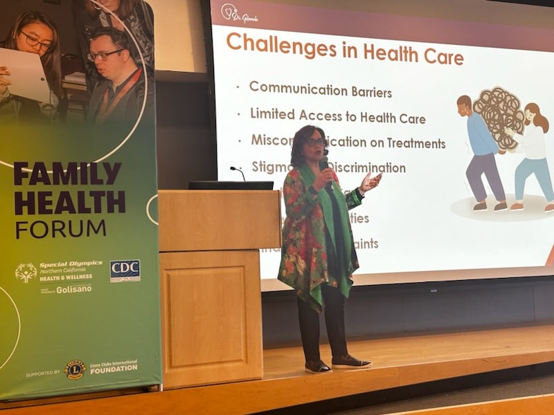 Dr. Newell-Harris speaks to a group on the challenges of healthcare.