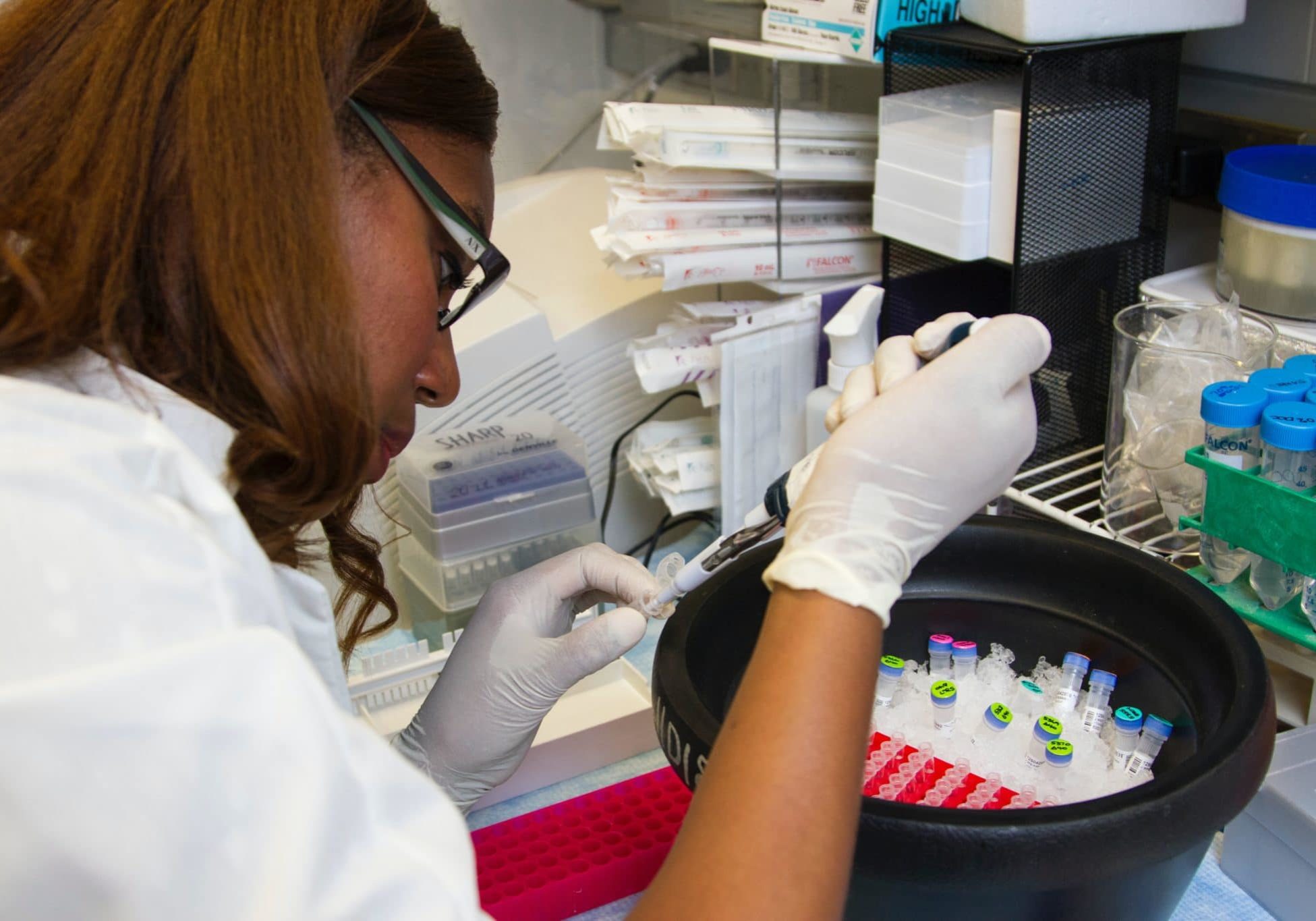 Medical Research Unsplash Black researcher working with vials in a lab